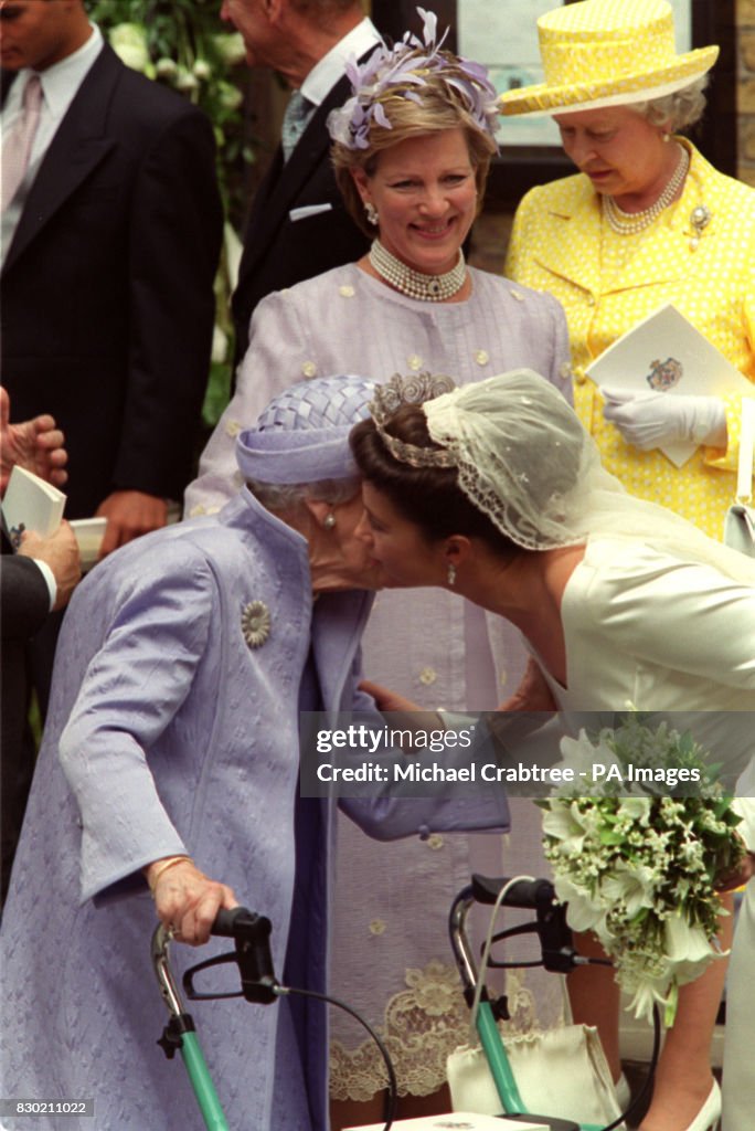 Greek Wedding/Queen kisses bride