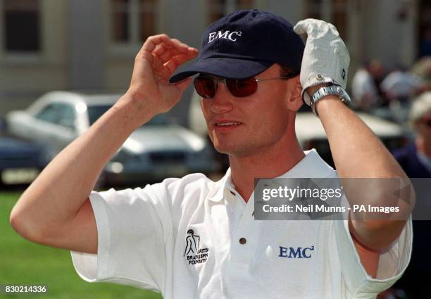 Mercedes McClaren's driver David Coulthard the winner of the British Grand Prix before he tees off for July 12 1999 charity golfing event sponsored...