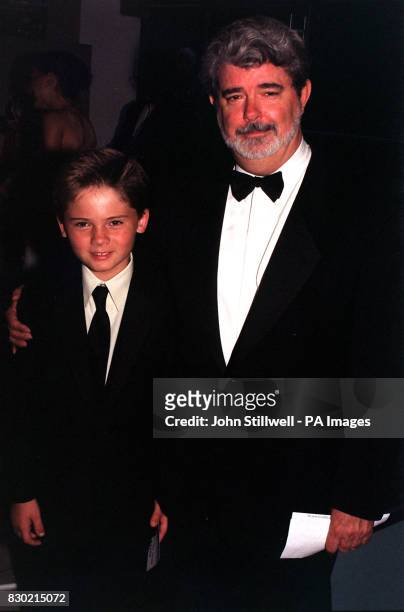 Director George Lucas and young film star, Jake Lloyd , arrive for the Royal Film Performance of "Star Wars : Episode 1 The Phantom Menace" at the...