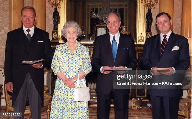 Britain's Queen Elizabeth II with Harri Holkeri, the former Prime Minister of Finland, who chaired the peace talks , Senator George Mitchell, who...