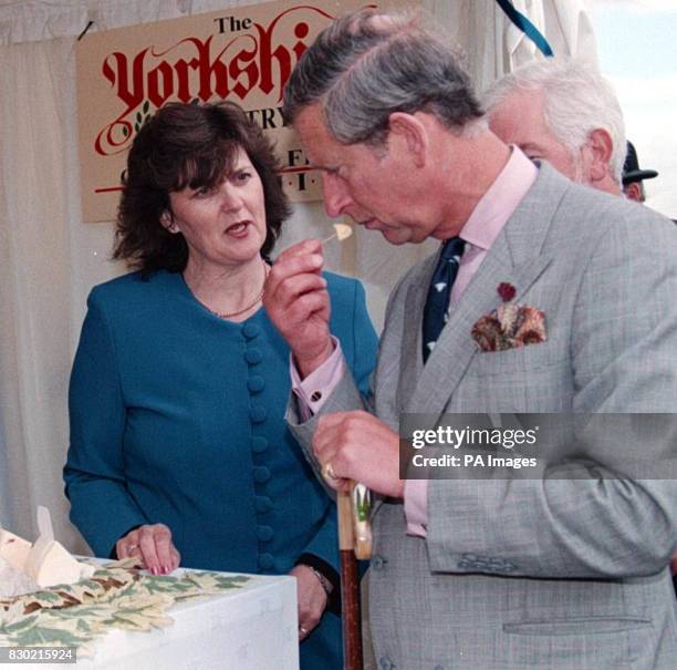 The Prince of Wales tries a cheese on selection from the Yorkshire Pantry as he tours the Great Yorkshire Show, Harrogate, North Yorkshire, with...