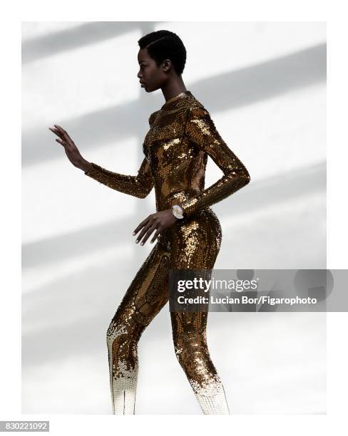 Model Maria Borges poses at a fashion shoot for Madame Figaro on July 8, 2017 in Paris, France. Outfit , Icarus Feathers bracelet and Fancy Vivid...