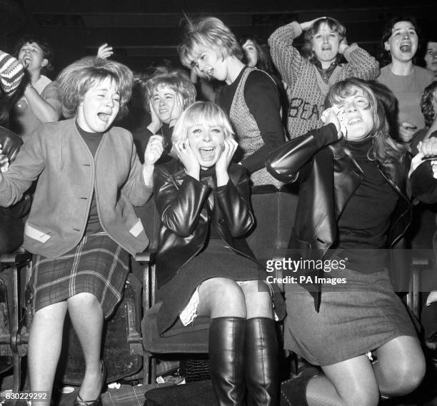 Screaming female fans of the pop group The Beatles, at one of their concerts in Manchester.