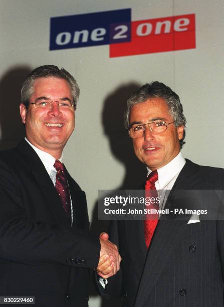 Tim Samples , Managing Director of the British cellular telephone company One 2 One with Dr Ron Sommer, Chairman of the Board of Management of...