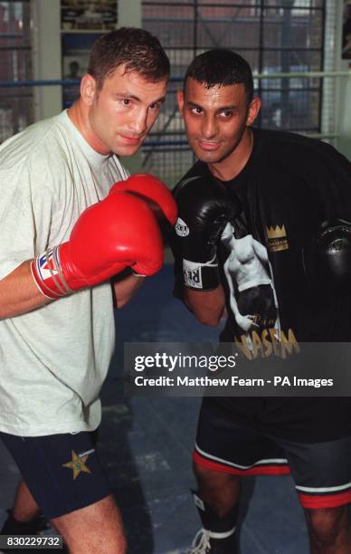 Swedish boxer Paolo Roberto and Britain's Prince Naseem Hamed after their sparring session at the Lennox Lewis Centre in London.