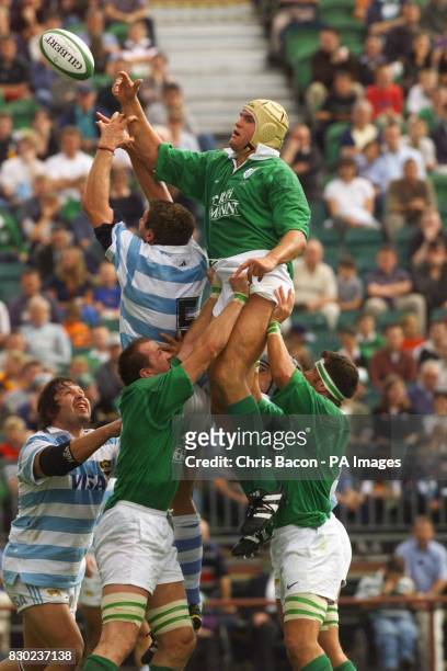 Ireland's Dion O'Cuinneagain and Trevor Brennan lift Jeremy Davidson to take the ball from Alejandro Allub of Argentina in a line-out during the...