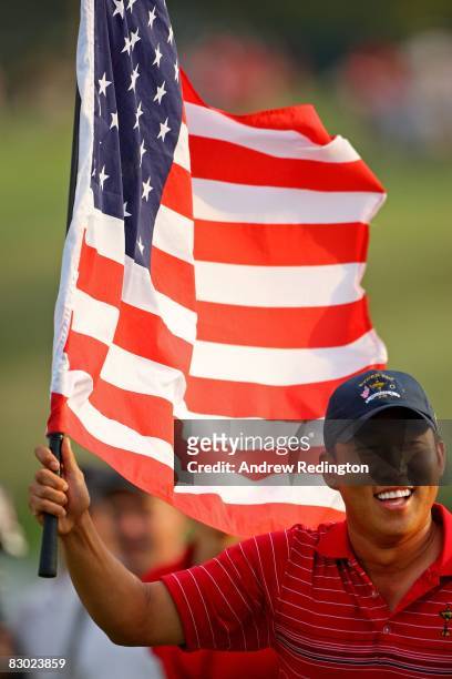 Anthony Kim holds an American flag as he celebrates the USA 16 1/2 - 11 1/2 victory on the final day of the 2008 Ryder Cup at Valhalla Golf Club on...