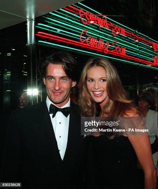 Elle Macpherson and Tim Jeffries arrive for the Royal European Charity Film Premiere of "The Flinstones" at London's Empire in Leicester Square.