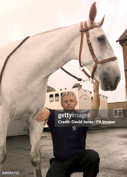 Staffordshire Police gelding Grenaby, whose stable name is Boris, with PC Terry Quinlan at the Police headquarters in Stafford. Boris was attacked by...