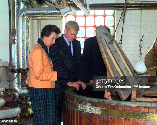 Princess Royal looks in to a Mash Tun with Head Brewer James Clarke at Hook Norton Breweery, Oxon, during her visit to celebrate brewery's 150th...