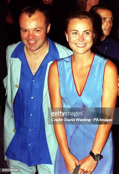Television presenter Graham Norton and Phillipa Forrester, presenter of Tomorrow's World, arrive at the opening party of 'Home', the biggest...