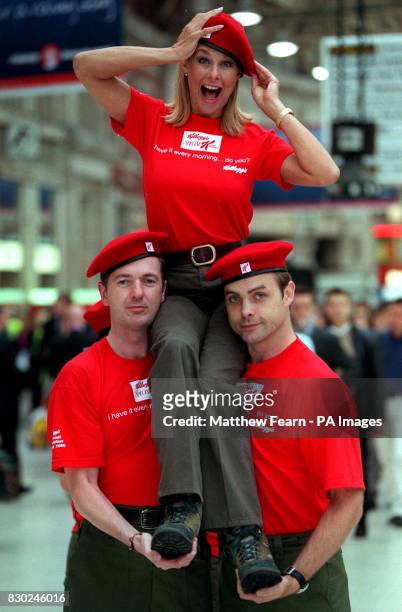 Jilly Johnson, former page three model, joins the 'Red Berets' at Waterloo station, London to launch the new cereal 'Speacial K red Berries'.