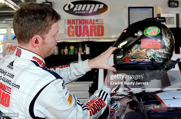 Dale Earnhardt Jr., driver of the the National Guard AMP Chevrolet prepares to drive during practice for the NASCAR Sprint Cup Series Camping World...