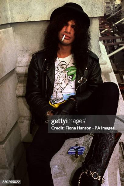 Guns 'n' Roses guitarist Slash, real name Saul Hudson, in London, prior to performing at the Freddie Mercury tribute concert at Wembley Stadium,...