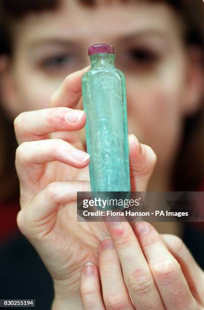 Christie South Kensington employee holds up an exceptional and rare acquamrine snuff bottle which is due to go on sale by the auction house in their...