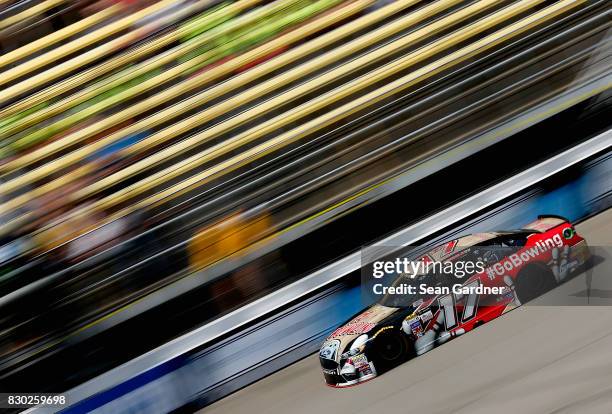 Ricky Stenhouse Jr., driver of the Go Bowling Ford, practices for the Monster Energy NASCAR Cup Series Pure Michigan 400 at Michigan International...