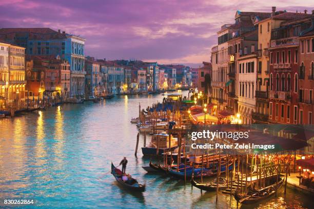 gondola on the grand canal in venice, italy - venedig gondel stock-fotos und bilder