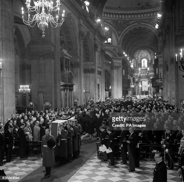 The coffin of Sir Winston Churchill is carried by Grenadier Guards through the vast congregation of 3, 000 as it leaves St. Paul's Cathedral after...