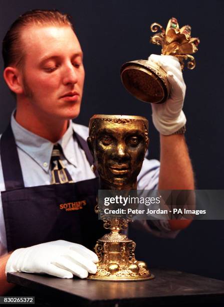 Gallery Porter Scott Riddell, examines a17th century silver-gilt German heraldic marriage cup, estimated value 1 000- 2 000. The art work went on...