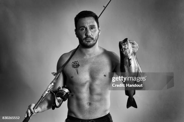 In this handout image provided by Red Bull, Blake Aldridge of the UK poses for a portrait prior to the first stop of the Red Bull Cliff Diving World...