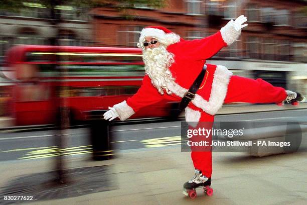 Mark Pargliuca as Father Christmas skates into Selfridges department store on Oxford Street, London. Pargliuca is thought to be the first Santa of...