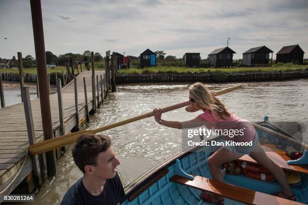 Holiday makers take the ferry to Southwold, which consists of a traditional rowing boat that has been run since 1885 by the same family for five...