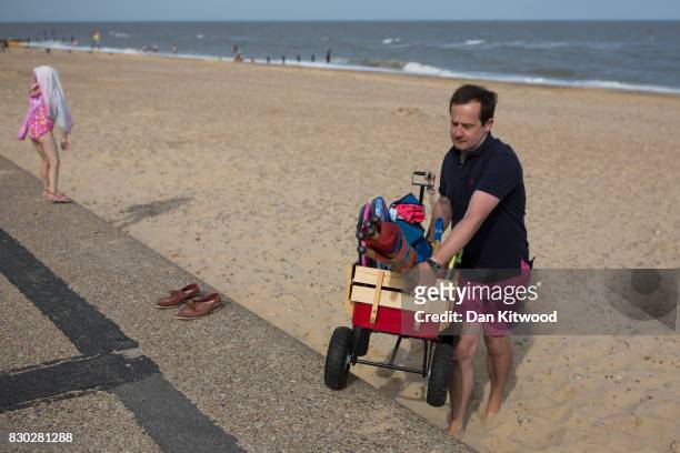 Holiday makers head home after a day at the seaside on August 11, 2017 in Southwold, England. Much of the country is expected to enjoy a sunny spell...