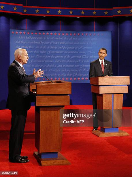 Republican presidential candidate John McCain makes a point as U.S. Democratic presidential candidate Barack Obama listens during the first U.S....