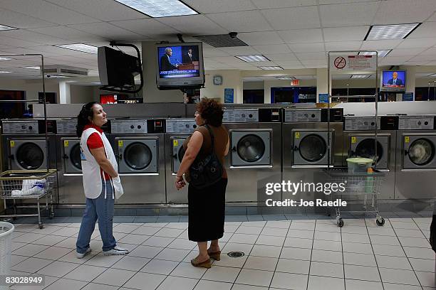 Magaly Gadivdo and Caridad Campos watch the debate between Republican presidential nominee U.S. Sen. John McCain and Democratic presidential nominee...