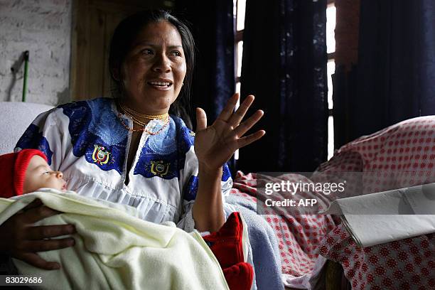 Etelvina Lechon with her daughters, speaks about the constitution summary at her home in Cayambe, Ecuador, on September 26, 2008. Ecuadorans vote...