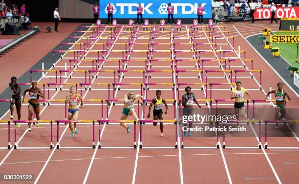 Sally Pearson of Australia on her way to winning her heat of the Women's 100 metres hurdles semi finals from (l-r Anne Zagre of Belgium, Phylicia...