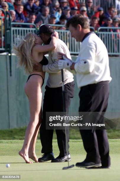 Library file dated 15.7.99 of American golf star Tiger Woods receiving a kiss from Yvonne Robb. The 21 year old lap dancer from Scotland was fined...