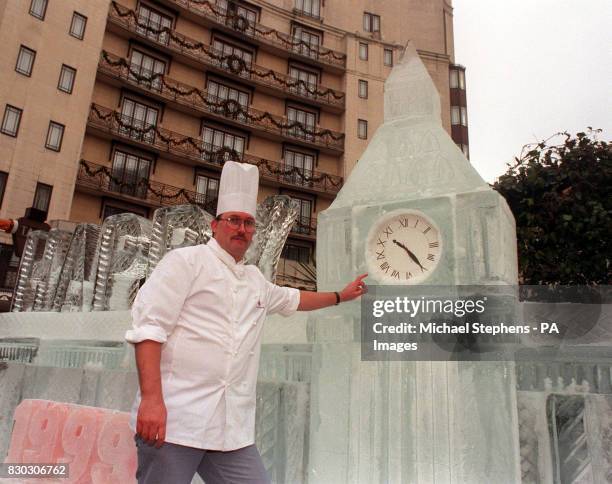 Dorchester chef Henry Brosi poses next to an ice sculpture of Big Ben which he helped build to wish passers-by a Happy Millennium 2000, during a...