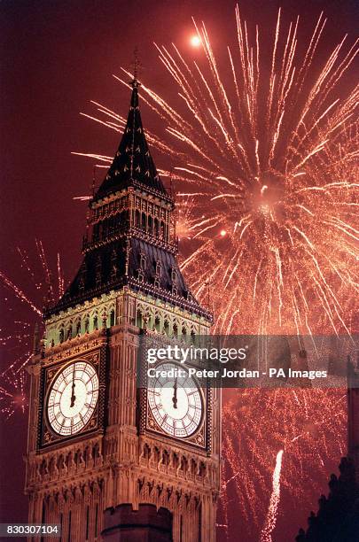 Fireworks explode over Big Ben, at the stroke of midnight, in London, to usher in the new millennium in the United Kingdom.