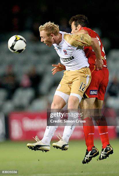 Paul Reid of United and Jobe Wheelhouse of the Jets compete for the ball during the round six A-League match between Adelaide United and the...