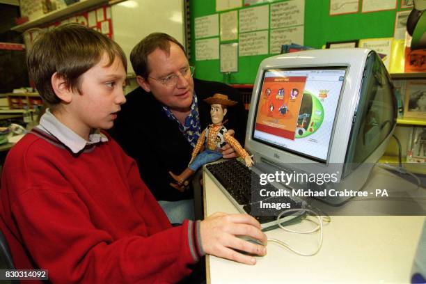 Year old Oliver Sim with John Lasseter, the director of the new Walt Disney film, Toy Story 2, at Bousfield Primary School in South London, for the...