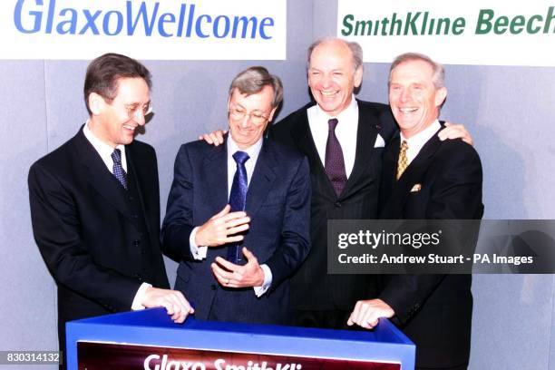 Photocall of the merger between drug companies Glaxo Wellcome and SmithKline Beecham, in London. L-R: John Coombe, Sir Richard Sykes; Jean-Pierre...