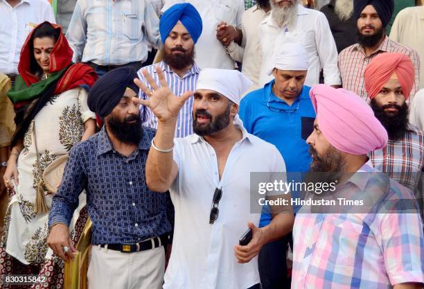 Bollywood actor Suniel Shetty with wife Mana Shetty on his birthday paying obeisance at Golden Temple on August 11, 2017 in Amritsar, India.