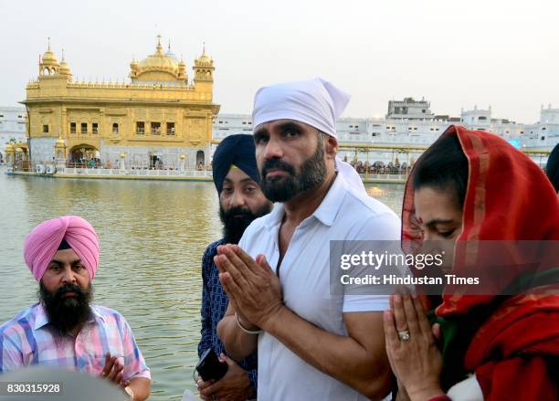 Bollywood actor Suniel Shetty with wife Mana Shetty on his birthday paying obeisance at Golden Temple on August 11, 2017 in Amritsar, India.