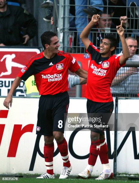 Arturo Vidal and Renato Augusto of Leverkusen celebrate after the 0-1 during the Bundesliga match between VfL Bochum and Bayer Leverkusen at the...