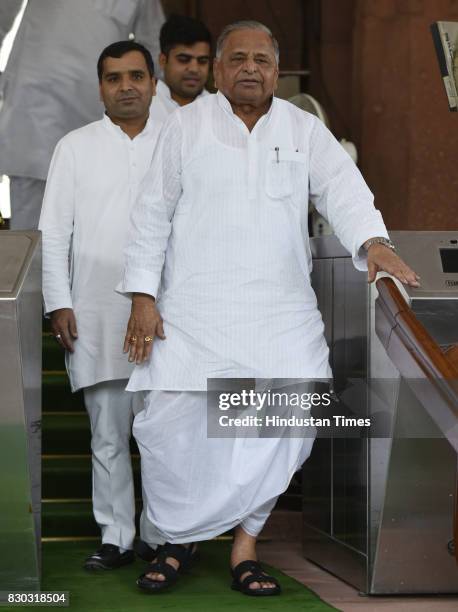 Mulayam Singh Yadav with Dharmendra Yadav and Tej Pratap Singh during Monsoon Session at Parliament on August 11, 2017 in New Delhi, India.