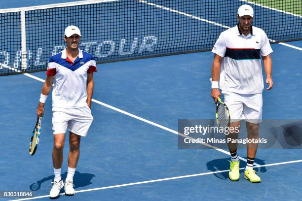 Fabrice Martin and teammate Edouard Roger-Vasselin of France look on in their doubles match against Raven Klaasen of Russia and Rajeev Ram of the...