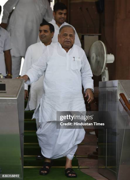 Mulayam Singh Yadav with Dharmendra Yadav and Tej Pratap Singh during Monsoon Session at Parliament on August 11, 2017 in New Delhi, India.