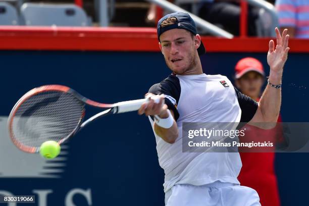 Diego Schwartzman of Argentina hits a return against Robin Haase of Netherlands during day eight of the Rogers Cup presented by National Bank at...