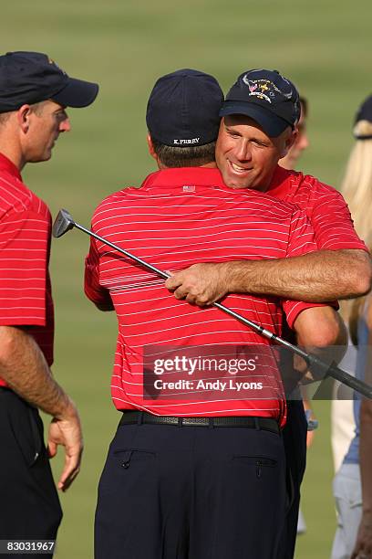 Stewart Cink of the USA team embraces a teammate during the singles matches on the final day of the 2008 Ryder Cup at Valhalla Golf Club on September...