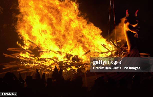 The "Jarl Squad" of guizers - Shetlanders dressed in viking costume - set fire to The Galley, a 30-foot wooden longship, whilst singing the "The...