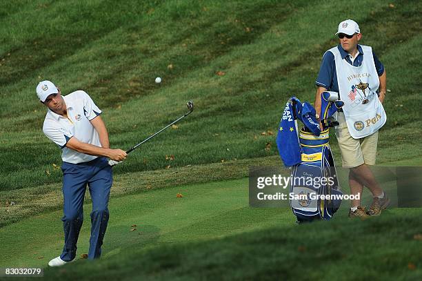 Oliver Wilson of the European team plays a shot alongside his caddie during the singles matches on the final day of the 2008 Ryder Cup at Valhalla...