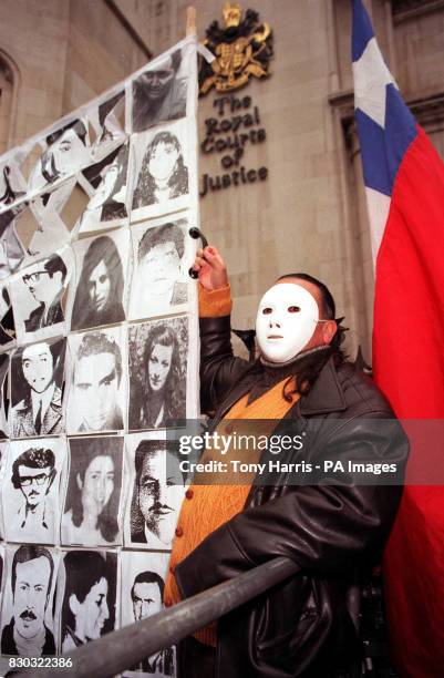Anti-Pinochet protestors outside the High Court in London, where judgement is given in the Belgium and six human rights groups bid to challenge the...