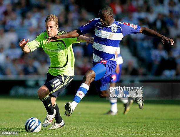 Damion Stewart of Queens Park Rangers battles for the ball with Rob Hulse of Derby County during the Coca Cola Championship match between Queens Park...