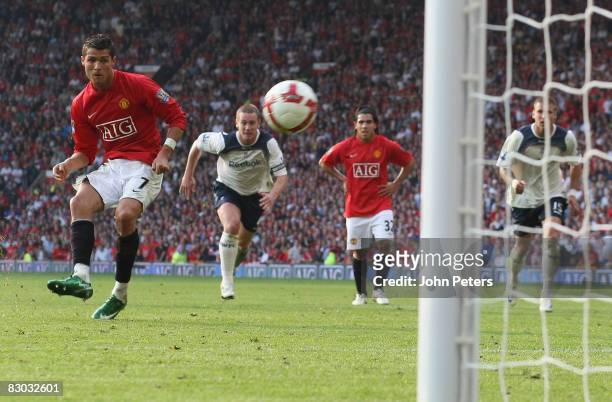 Cristiano Ronaldo of Manchester United scores their first goal during the FA Premier League match between Manchester United and Bolton Wanderers at...